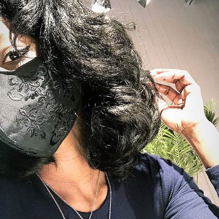 Yani from Massachusetts modeling Vampfangs' black brocade embroidered face mask. Beautiful and comfortable.