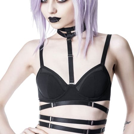 Model wearing the Tourniquet Bra. It is very strappy with adjustable straps that go around your midsection. It also finishes with a double strap choker which is also adjustable.