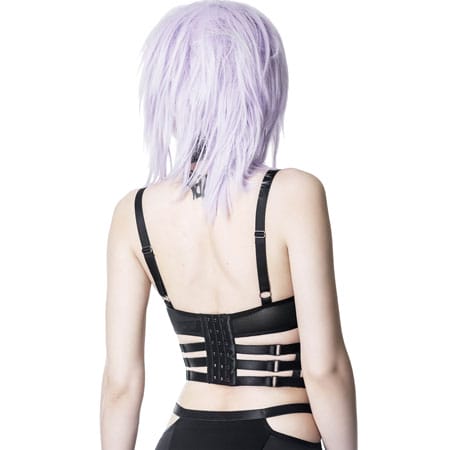 This is a model photographed from the backside wearing the Tourniquet Bra. This is very strappy and creates a cage-like appearance.