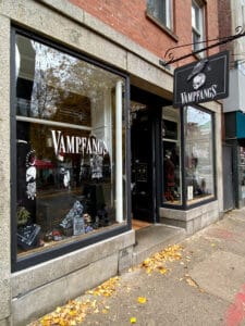 Outside of the Vampfangs Salem Shop showing the sign and windows.
